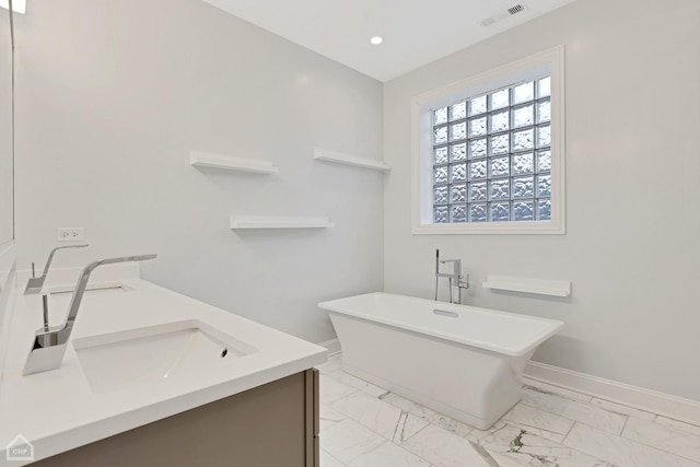 bathroom with vanity and a bathtub