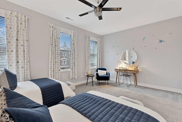 bedroom with ceiling fan and carpet