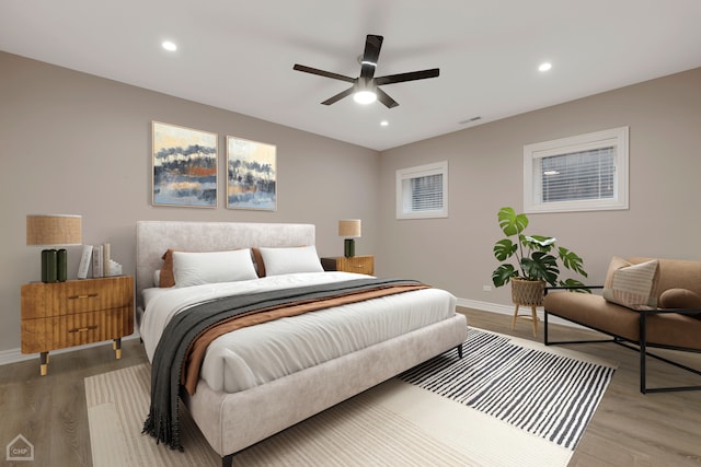 bedroom featuring ceiling fan and light wood-type flooring