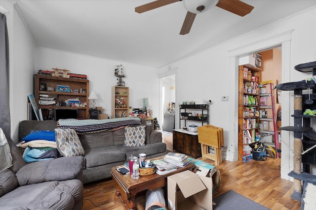 living room featuring hardwood / wood-style floors and ceiling fan