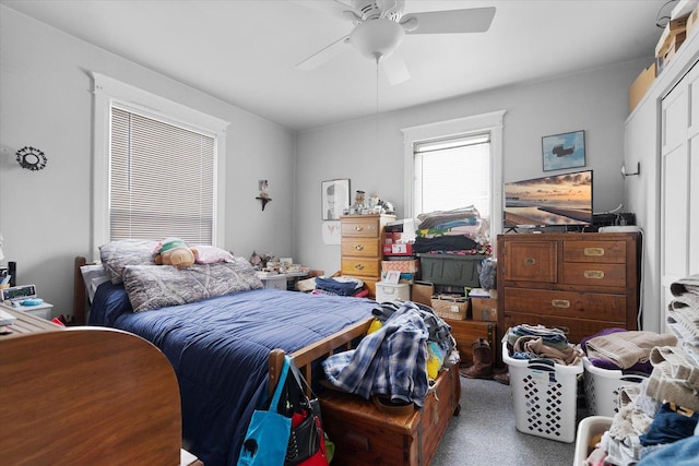 carpeted bedroom with ceiling fan