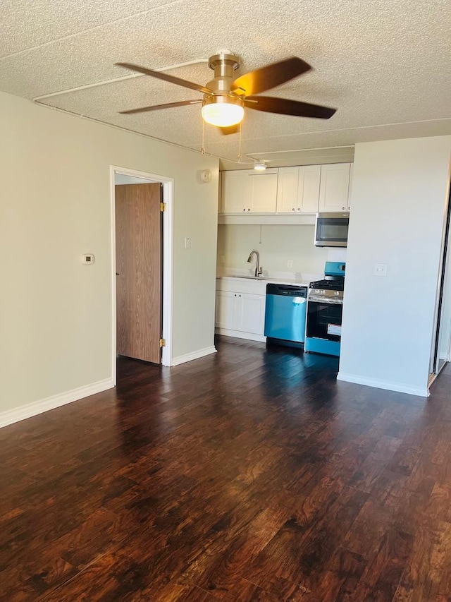 kitchen with white cabinetry, dark hardwood / wood-style flooring, and stainless steel appliances