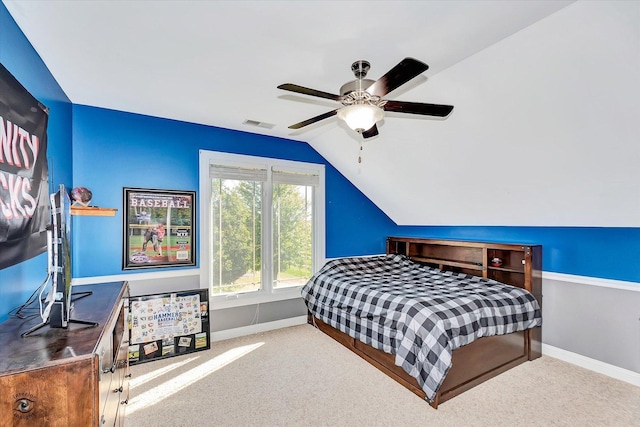 carpeted bedroom featuring ceiling fan and lofted ceiling