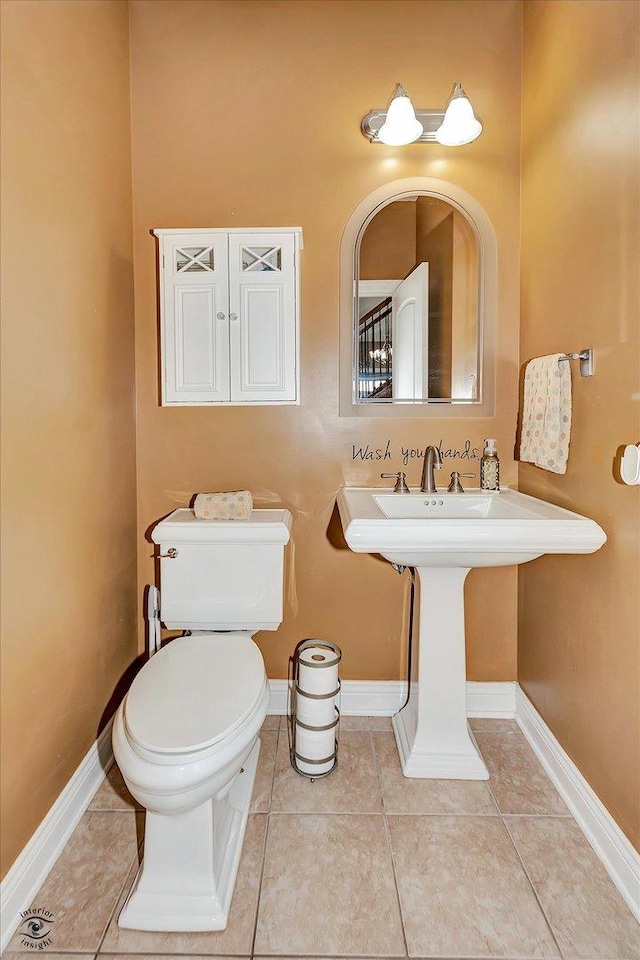 bathroom featuring tile patterned floors and toilet