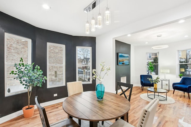 dining room with light hardwood / wood-style flooring