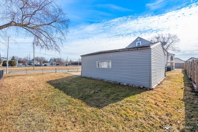 exterior space featuring a fenced backyard and central AC