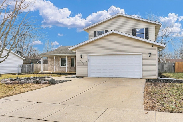 traditional-style house featuring fence and driveway