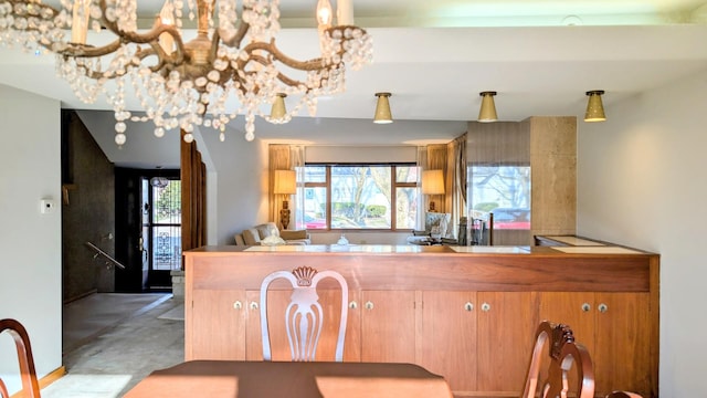 9018 S Oakley Ave, Chicago, IL 60643 - kitchen featuring a chandelier and concrete floors