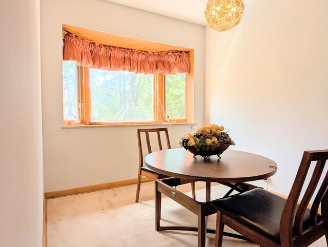 9018 S Oakley Ave, Chicago, IL 60643 - carpeted dining area with baseboards and a chandelier