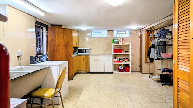 9018 S Oakley Ave, Chicago, IL 60643 - kitchen with washer / clothes dryer, white microwave, light floors, and light countertops