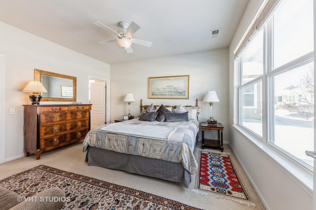 carpeted bedroom with ceiling fan