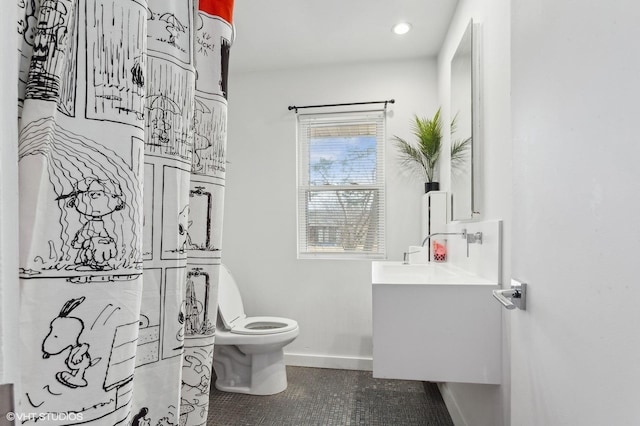 bathroom with vanity and toilet