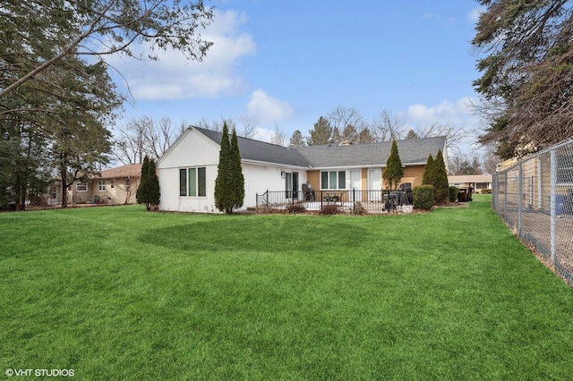 rear view of house with a lawn