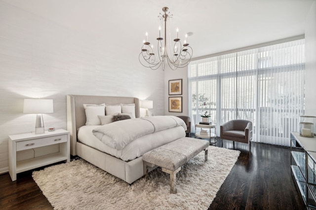 bedroom with floor to ceiling windows, dark hardwood / wood-style flooring, and a notable chandelier