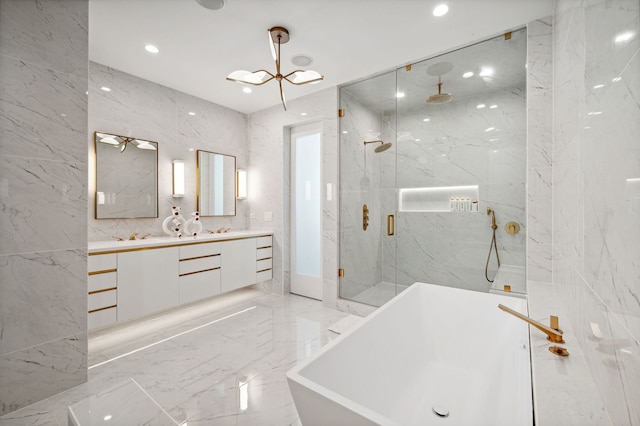 bathroom with vanity, tile walls, independent shower and bath, and a chandelier