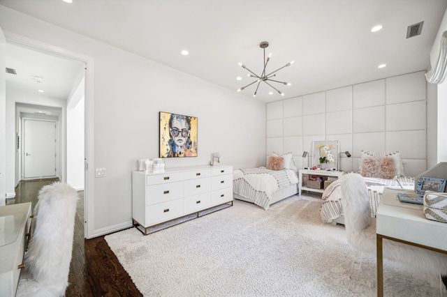 bedroom featuring an inviting chandelier