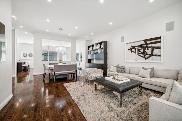 living room featuring dark hardwood / wood-style flooring