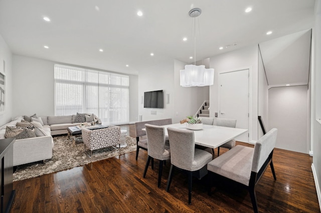 dining space featuring dark wood-type flooring