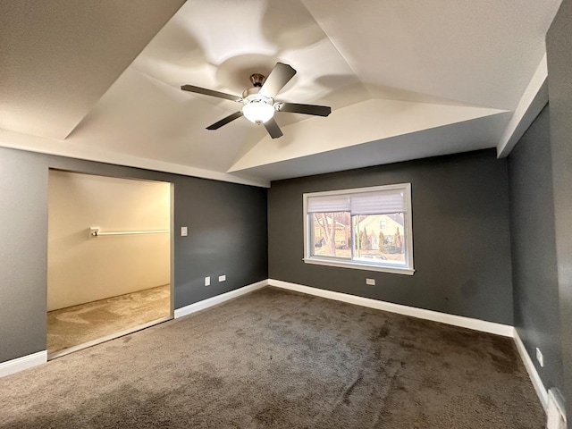 unfurnished bedroom with lofted ceiling, carpet, and ceiling fan