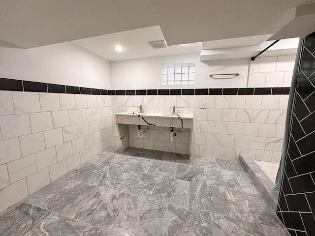 bathroom with tile walls