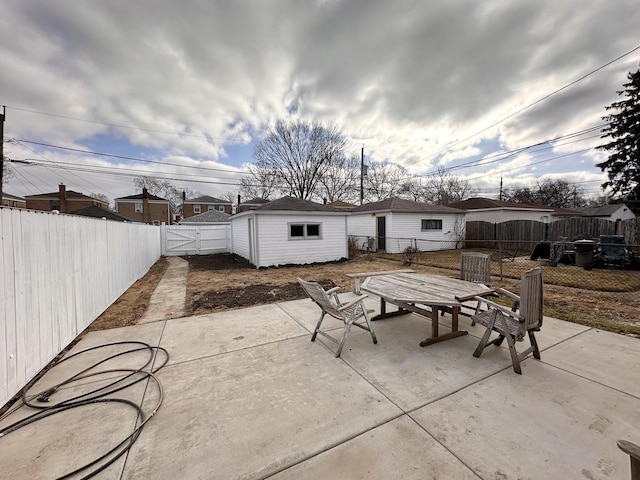 view of patio featuring an outbuilding