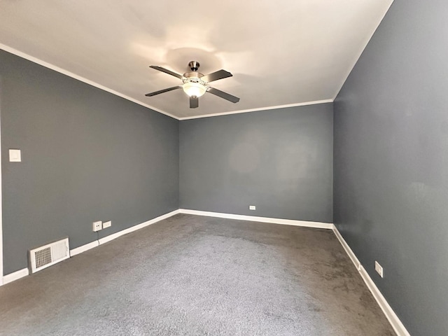 spare room with ceiling fan, ornamental molding, and carpet flooring