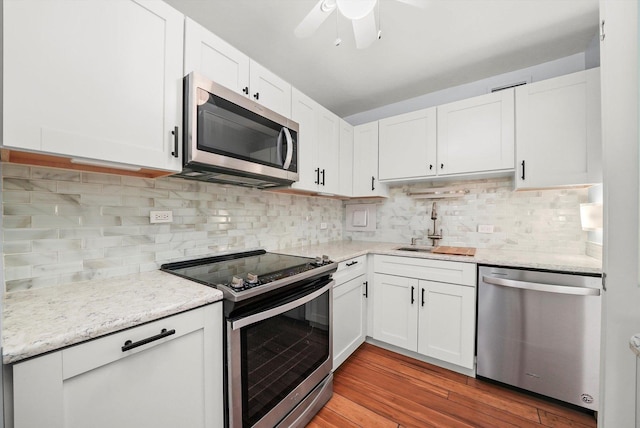 kitchen featuring white cabinetry, stainless steel appliances, and sink