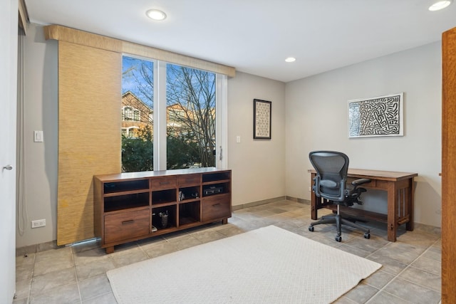 office space with baseboards and recessed lighting