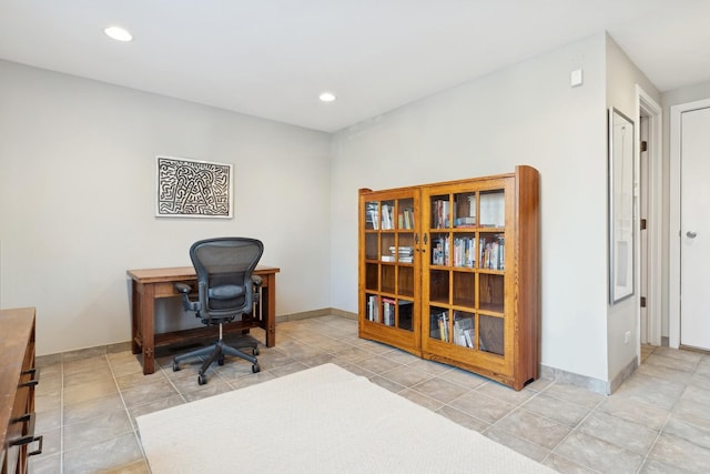 tiled office space with baseboards and recessed lighting