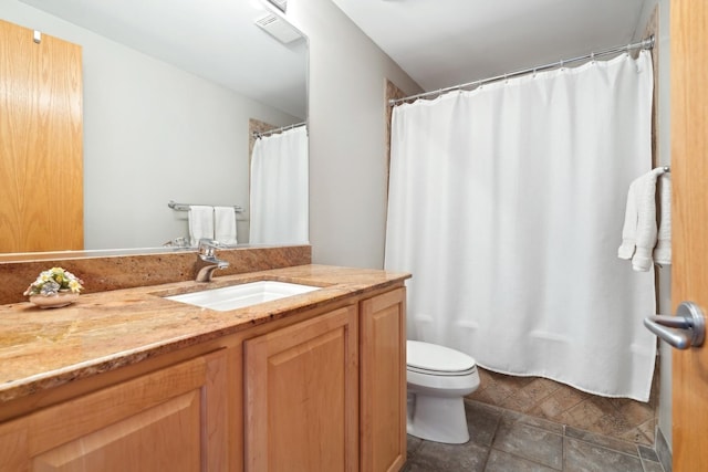 bathroom with visible vents, a shower with shower curtain, vanity, and toilet