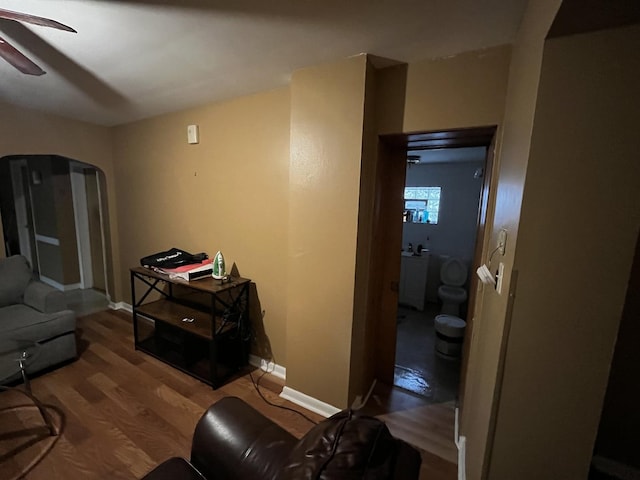 living room featuring hardwood / wood-style flooring and ceiling fan