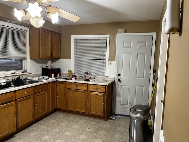 kitchen with sink and decorative backsplash