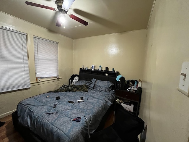 bedroom with hardwood / wood-style floors and ceiling fan