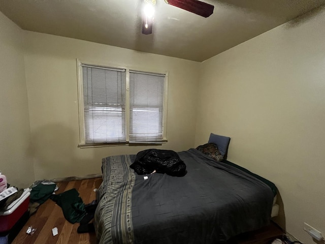 bedroom with hardwood / wood-style flooring and ceiling fan