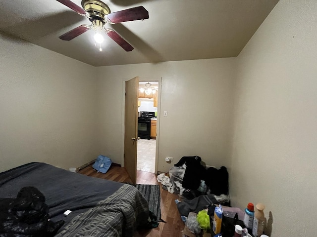 bedroom featuring wood-type flooring and ceiling fan