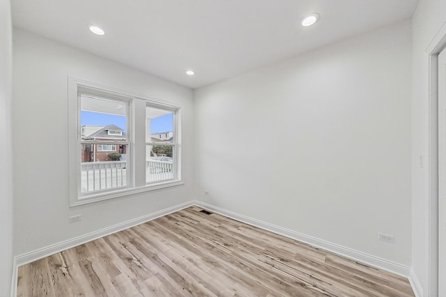 spare room with light wood-type flooring