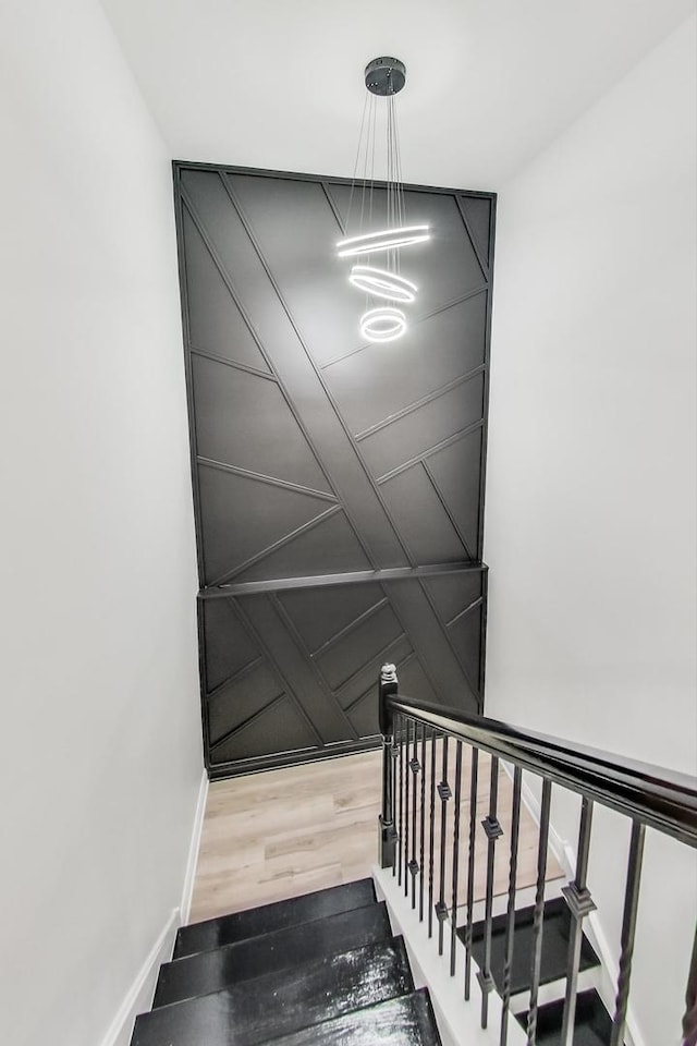 staircase featuring hardwood / wood-style floors