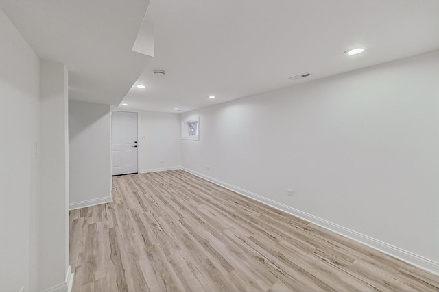 basement featuring light hardwood / wood-style flooring