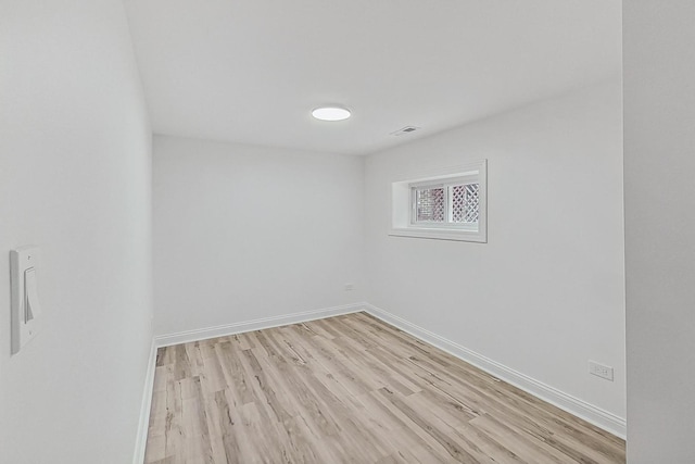 spare room featuring light hardwood / wood-style flooring