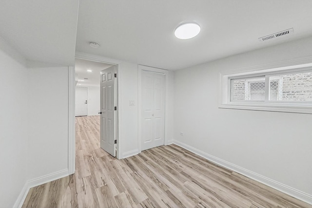 unfurnished room with light hardwood / wood-style floors