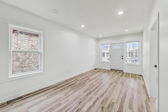 foyer with light hardwood / wood-style flooring