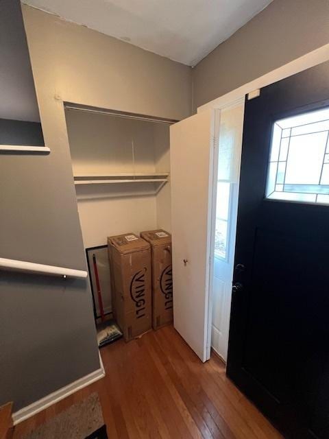 foyer with separate washer and dryer and hardwood / wood-style floors