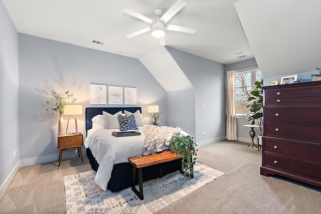 carpeted bedroom with ceiling fan and lofted ceiling