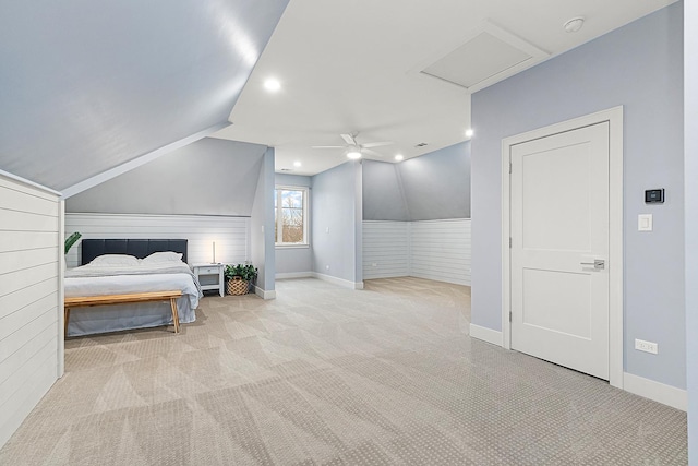 carpeted bedroom featuring ceiling fan and vaulted ceiling