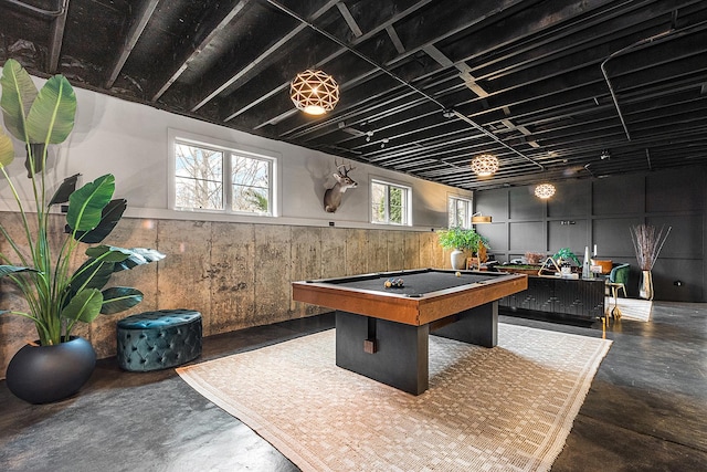 playroom featuring wooden walls and billiards