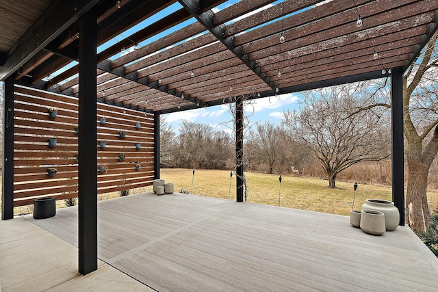 wooden deck with a pergola and a lawn