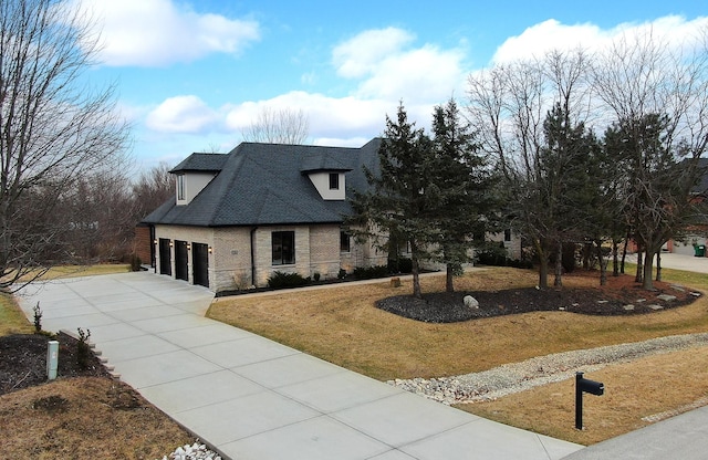 french country inspired facade with a garage and a front lawn