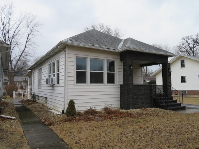 view of home's exterior with cooling unit