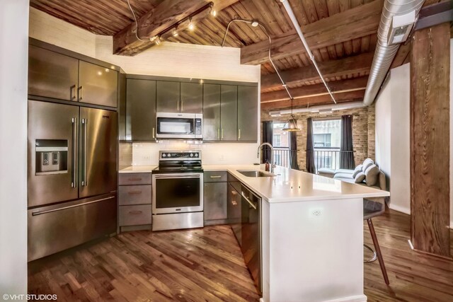 living room featuring brick wall, beamed ceiling, a chandelier, hardwood / wood-style flooring, and wooden ceiling