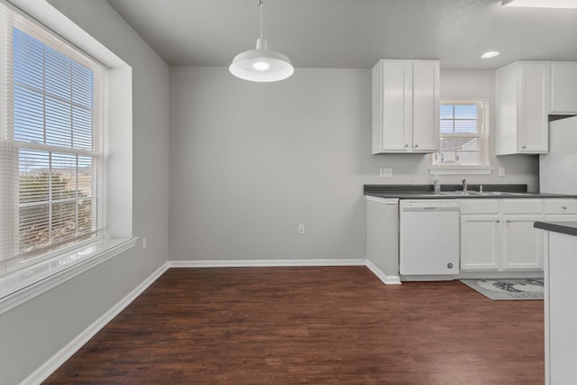 kitchen with pendant lighting, white cabinets, dark wood-type flooring, and dishwasher